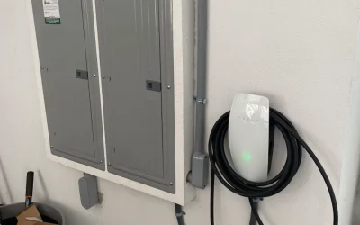 tesla-wall-connector-installed-next-to-panels tesla-wall-connector-installed-next-to-panels
